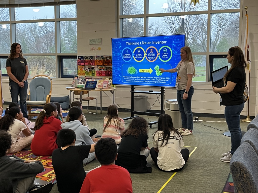 students learn about 3D printing during a presentation in the school library