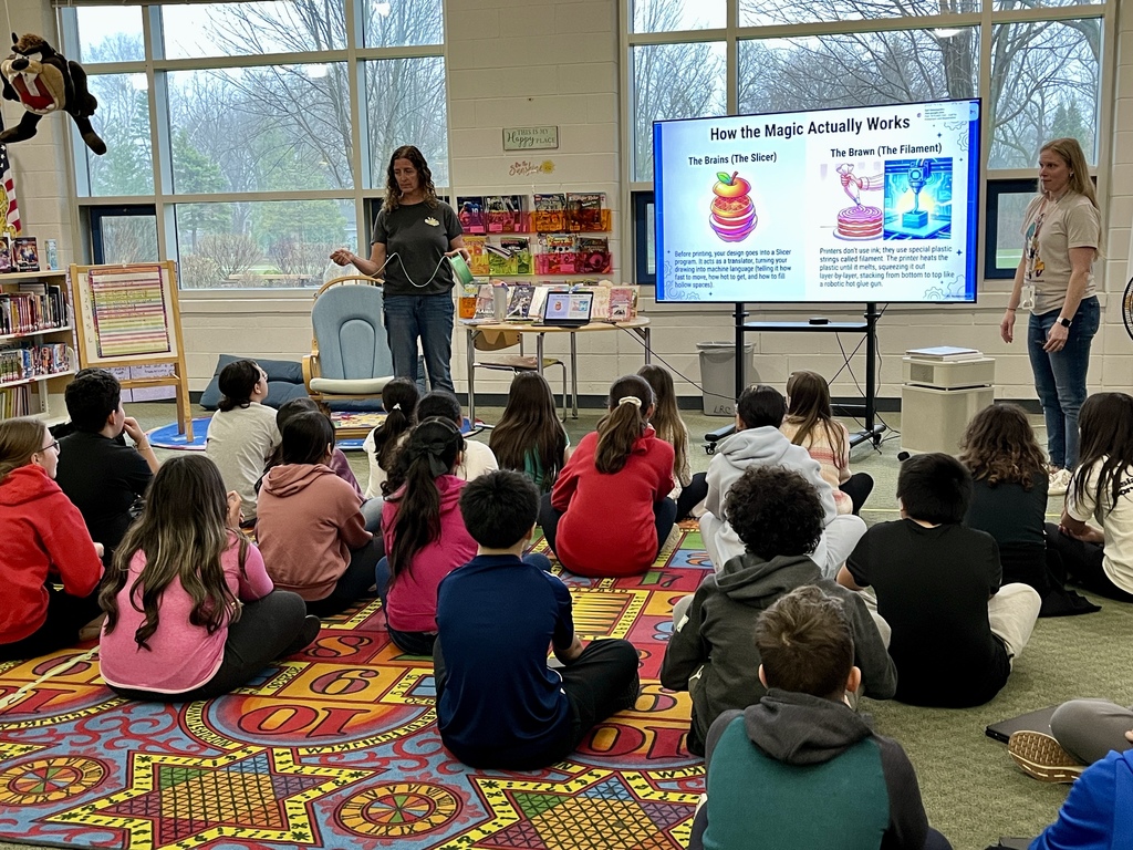 students learn about 3D printing during a presentation in the school library