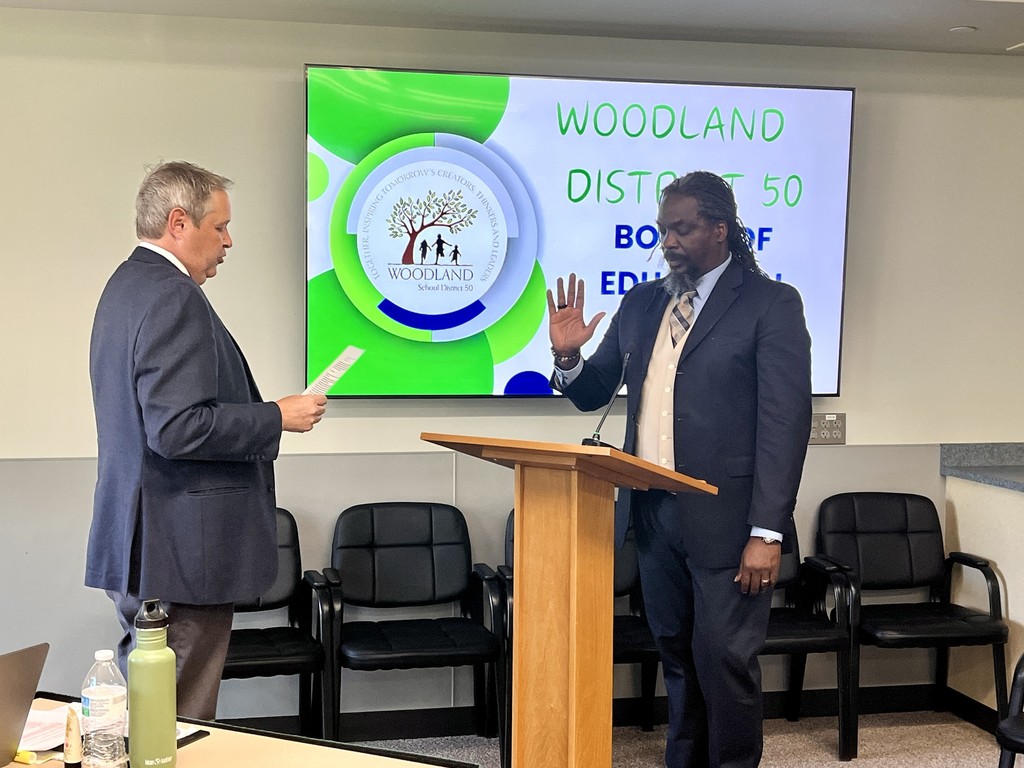 New Board Member, Jay Wiltshire, takes the Oath of Office administered by Joel Zwiefelhofer