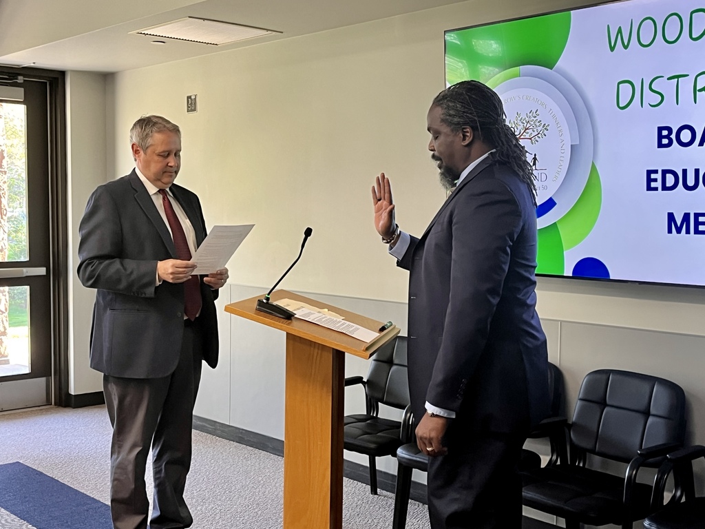 New Board Member, Jay Wiltshire, takes the Oath of Office administered by Joel Zwiefelhofer