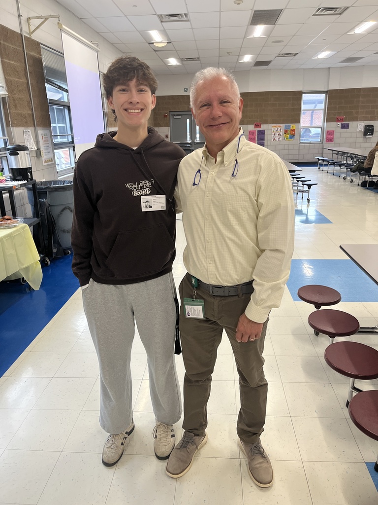 High School volutneer with Elementary Assistant Principal (Father and Son)
