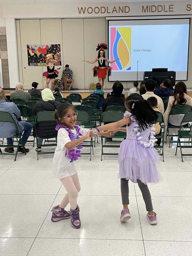 Students dancing to a performance 