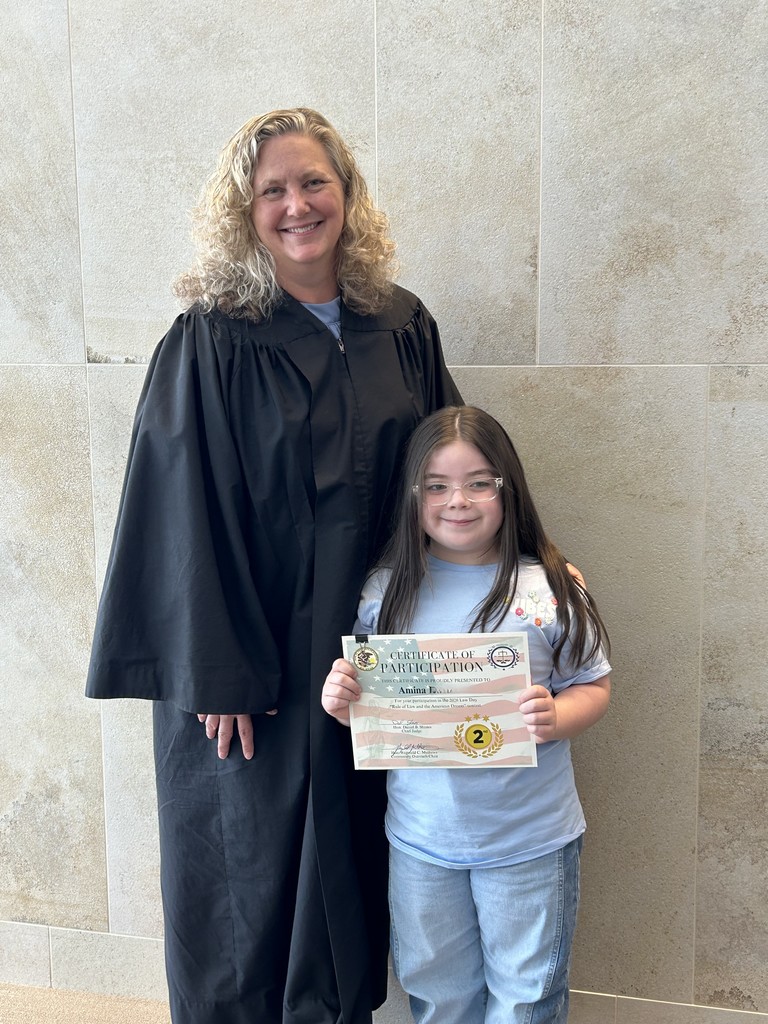 Student artist poses with a Lake County Judge for Law Day May 2026
