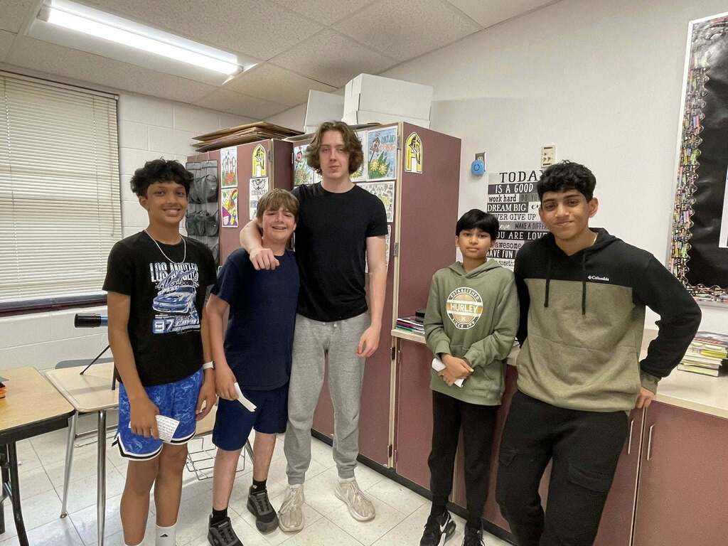 Students giving presentations to their classmates on famous figures in history