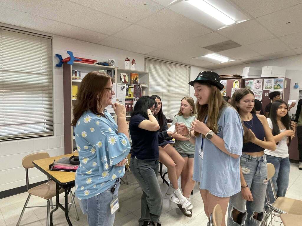 Students giving presentations to their classmates on famous figures in history