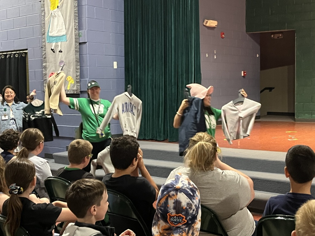 Staff "Fashion" Show with items from the Lost & Found