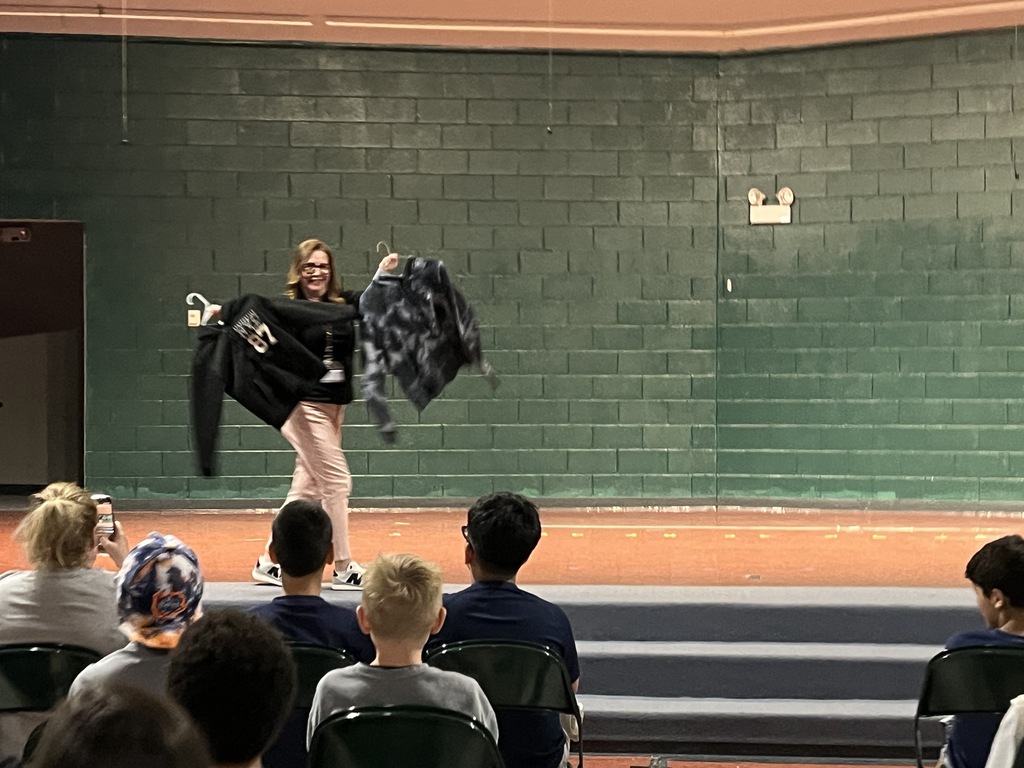 Staff "Fashion" Show with items from the Lost & Found