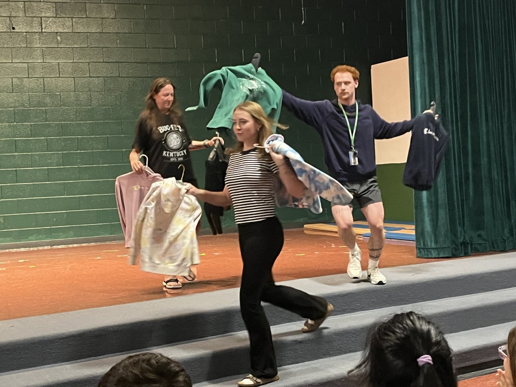 Staff "Fashion" Show with items from the Lost & Found