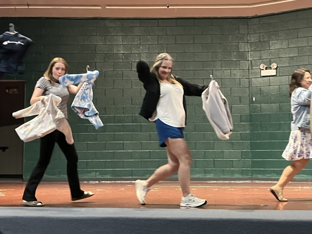 Staff "Fashion" Show with items from the Lost & Found
