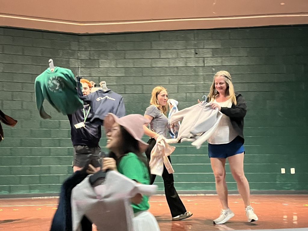 Staff "Fashion" Show with items from the Lost & Found