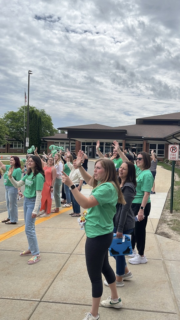 Last day of school at Woodland Elementary. The staff is outside to wave goodbye to the buses!