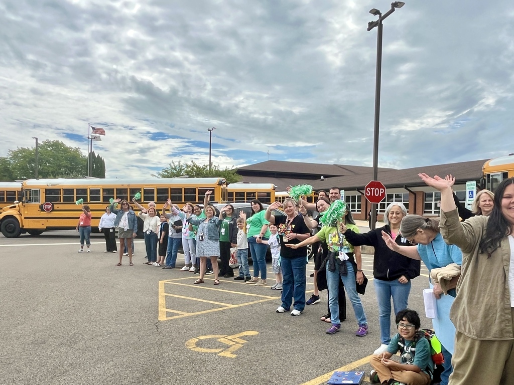 Last day of school at Woodland Elementary. The staff is outside to wave goodbye to the buses!