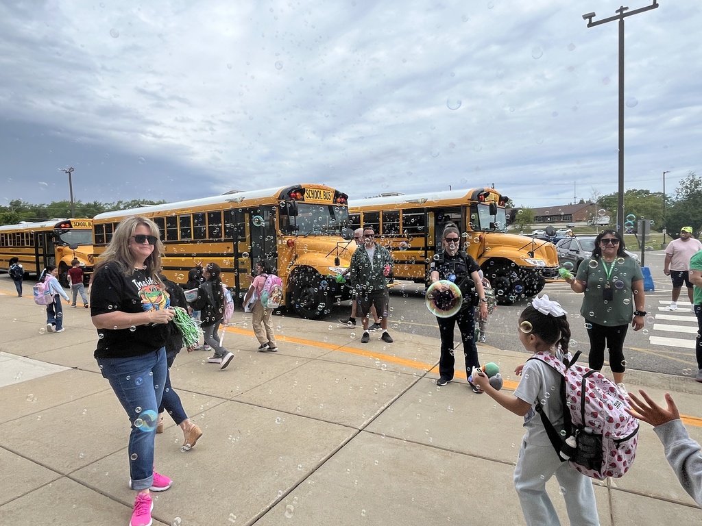 Last day of school at Woodland Elementary. The staff is outside to wave goodbye to the buses!