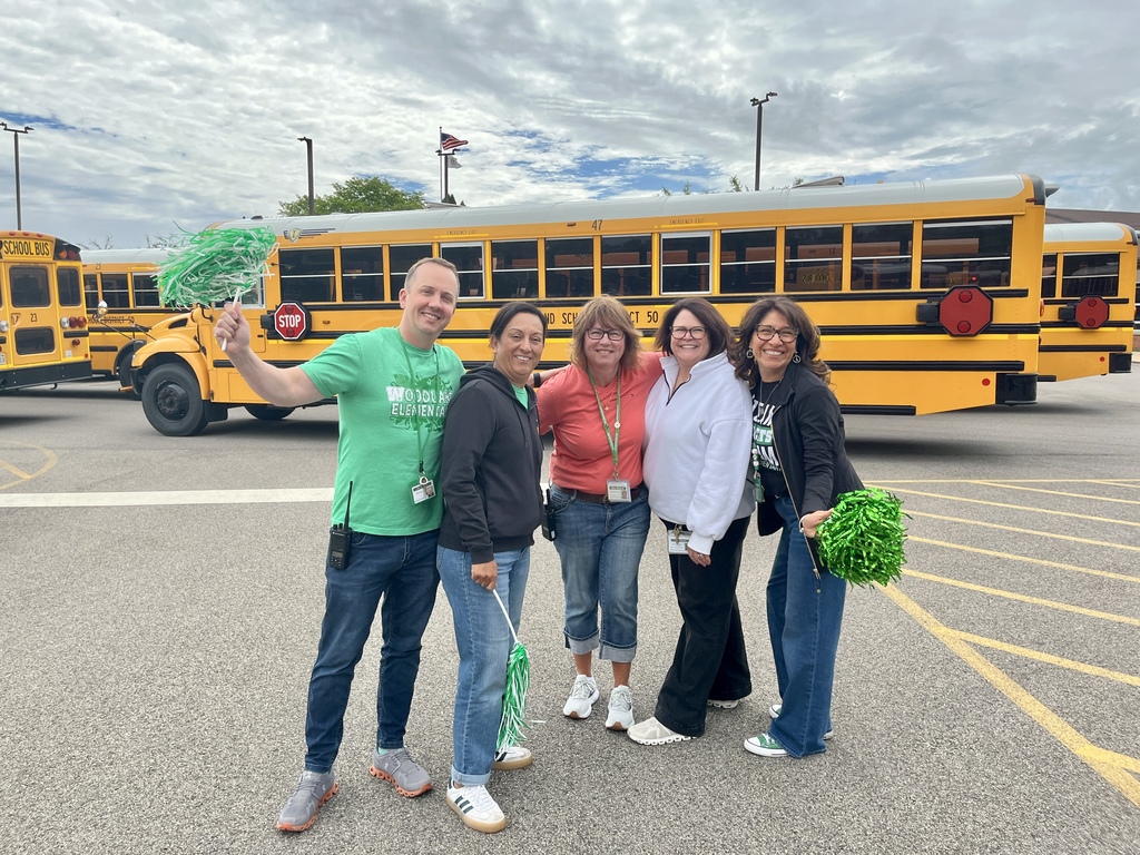 Last day of school at Woodland Elementary. The staff is outside to wave goodbye to the buses!