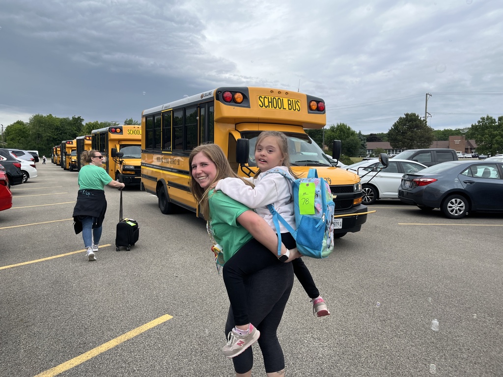 Last day of school at Woodland Elementary. The staff is outside to wave goodbye to the buses!
