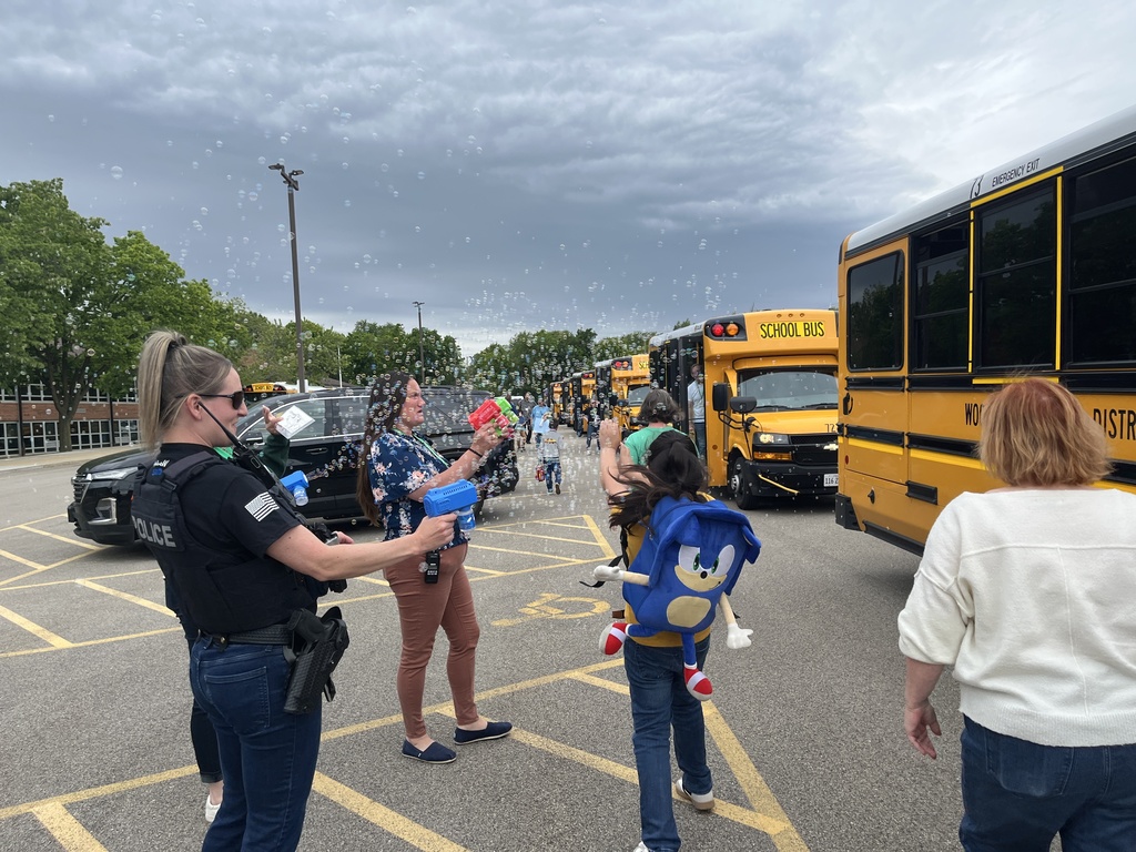 Last day of school at Woodland Elementary. The staff is outside to wave goodbye to the buses!
