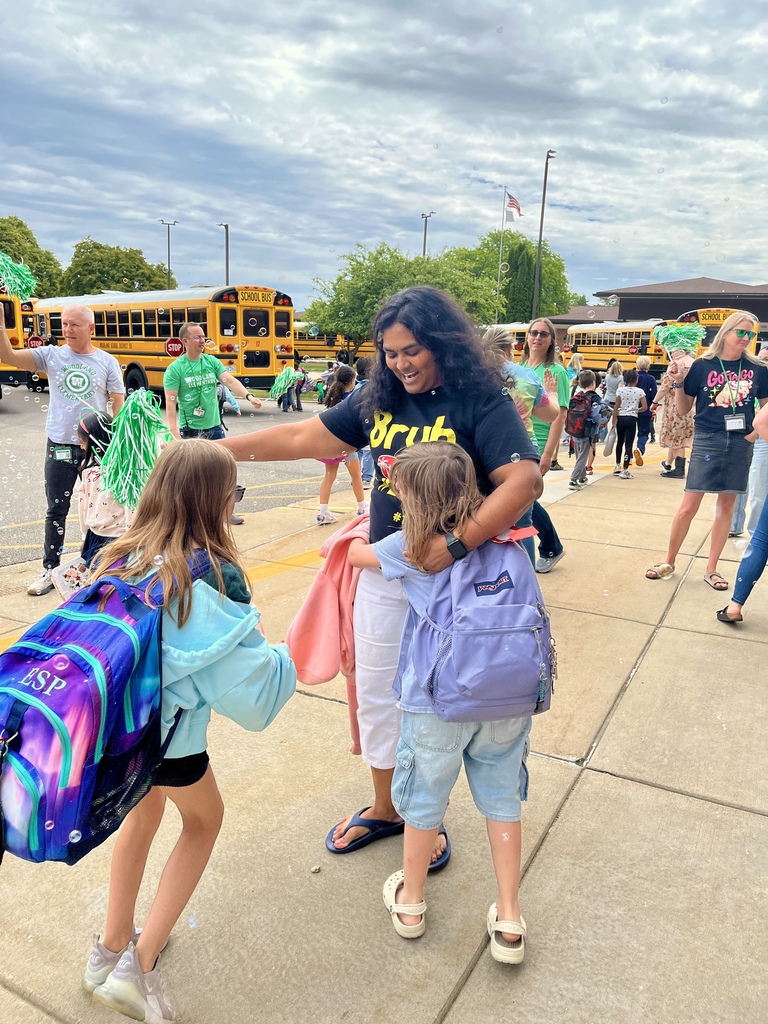 Last day of school at Woodland Elementary. The staff is outside to wave goodbye to the buses!
