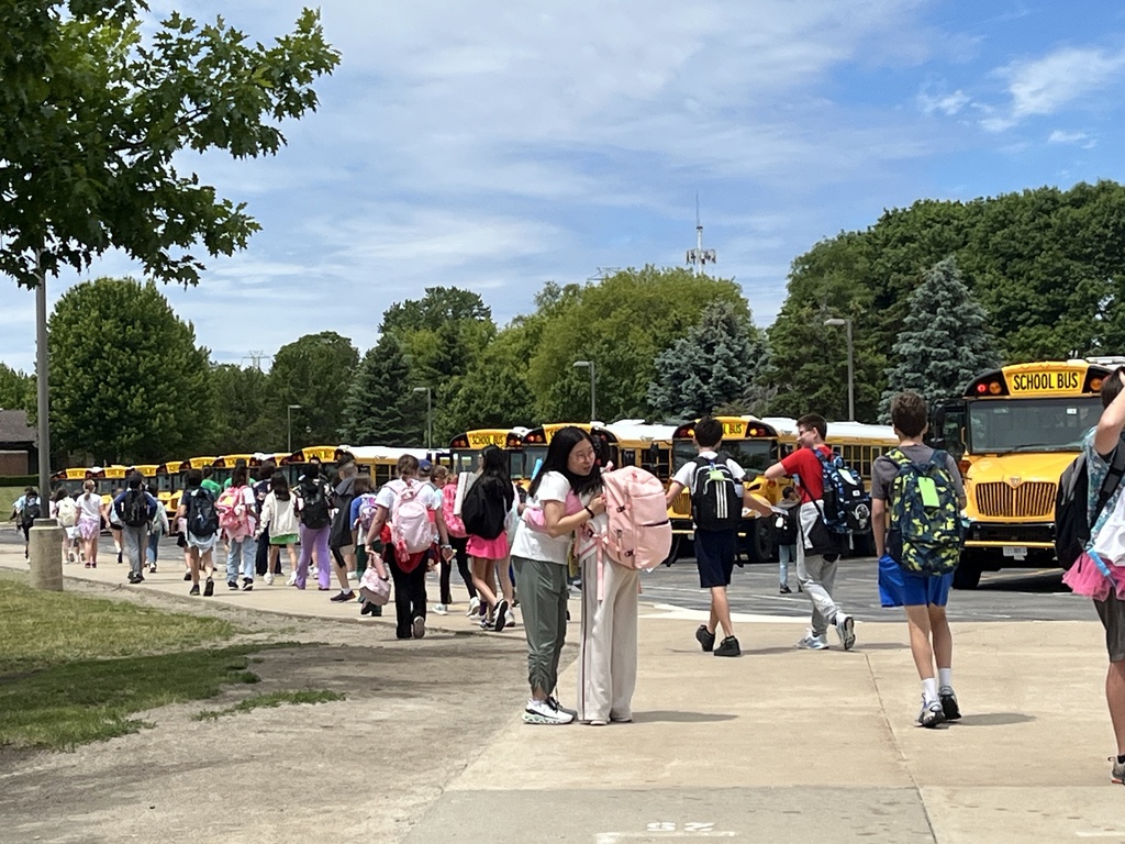 Last Day of School at Woodland Intermediate, students walking toward their buses
