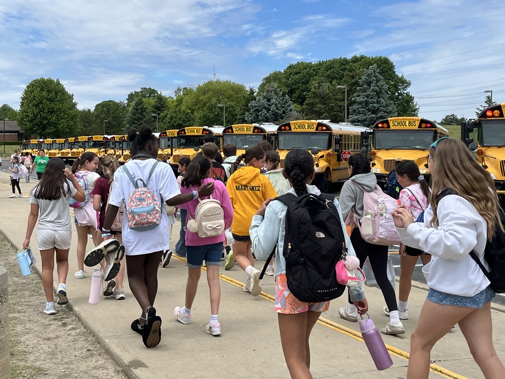 Last Day of School at Woodland Intermediate, students walking toward their buses