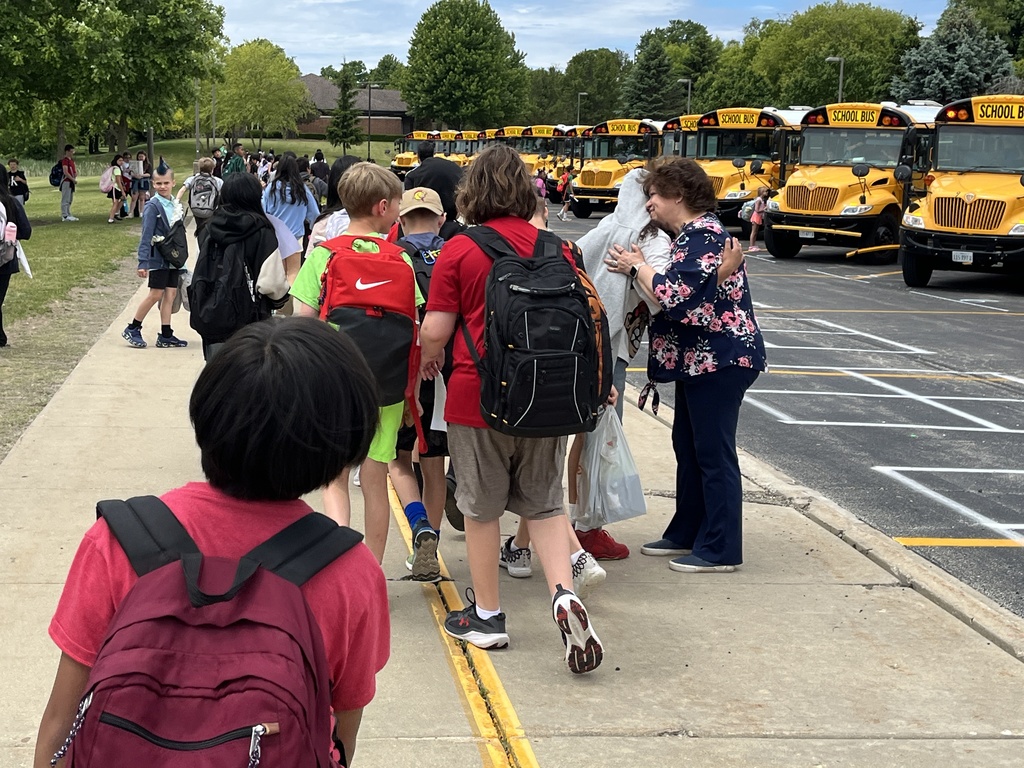 Last Day of School at Woodland Intermediate, students walking toward their buses