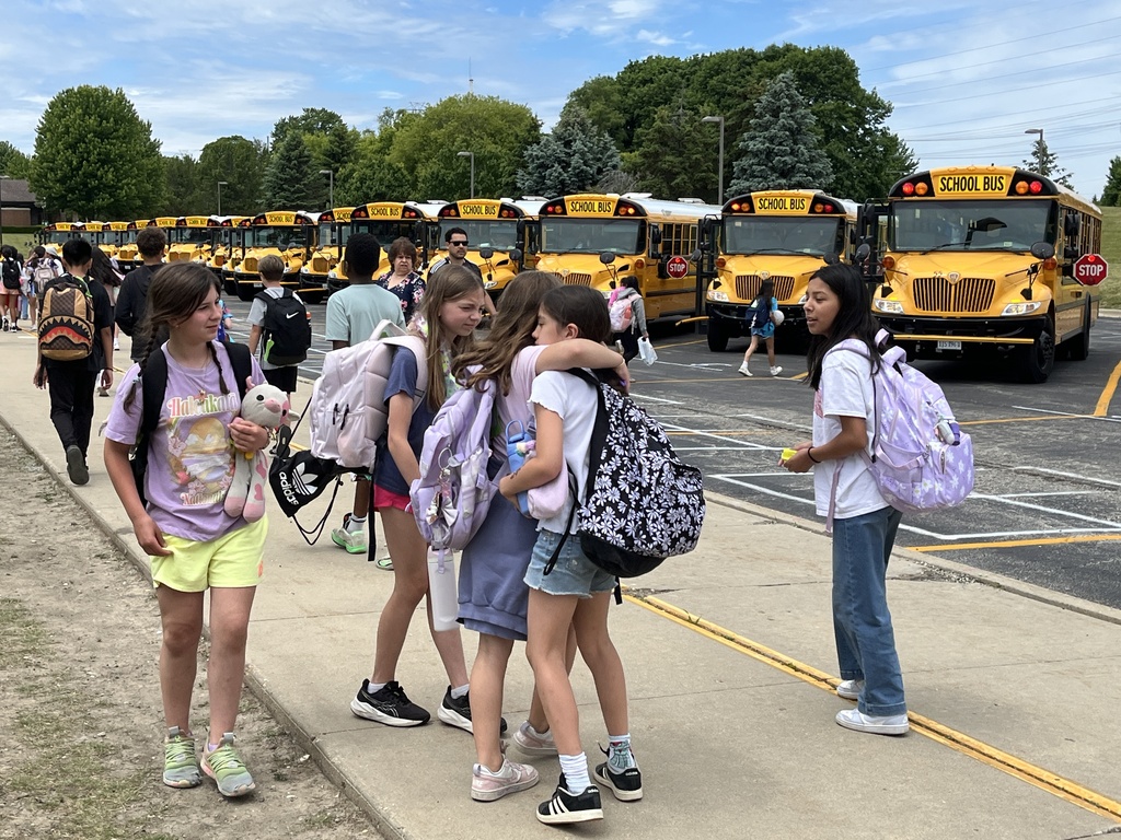 Last Day of School at Woodland Intermediate, students walking toward their buses