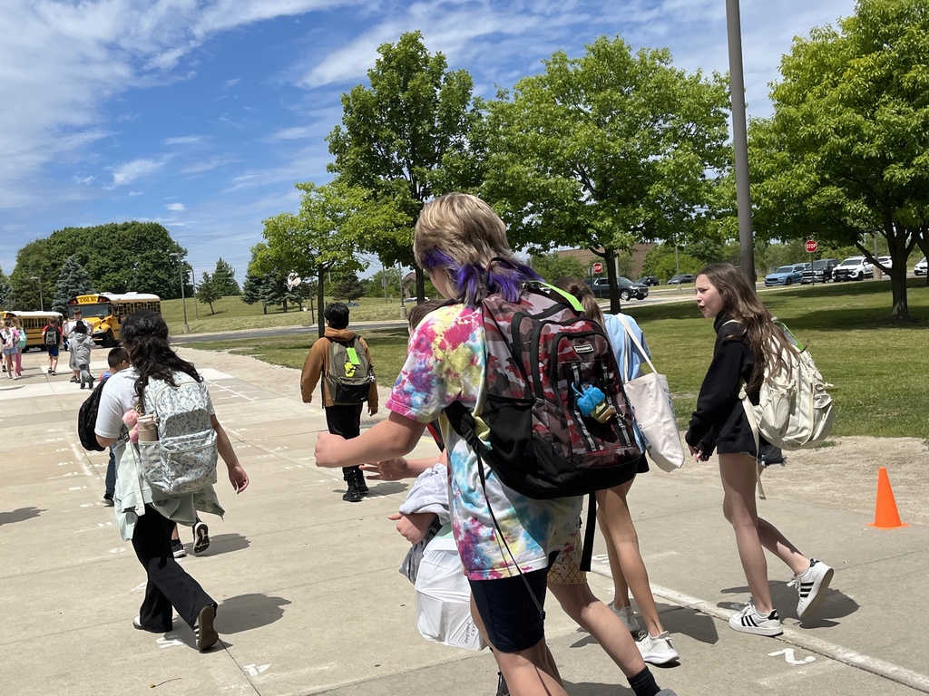 Last Day of School at Woodland Intermediate, students walking toward their buses