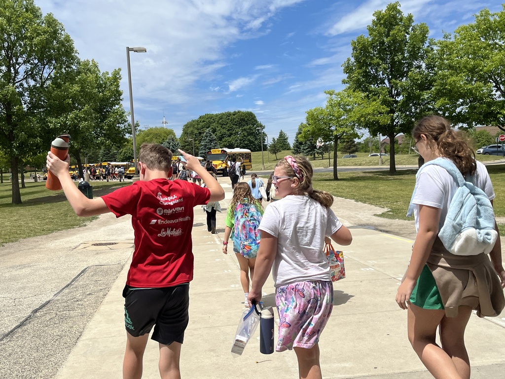 Last Day of School at Woodland Intermediate, students walking toward their buses