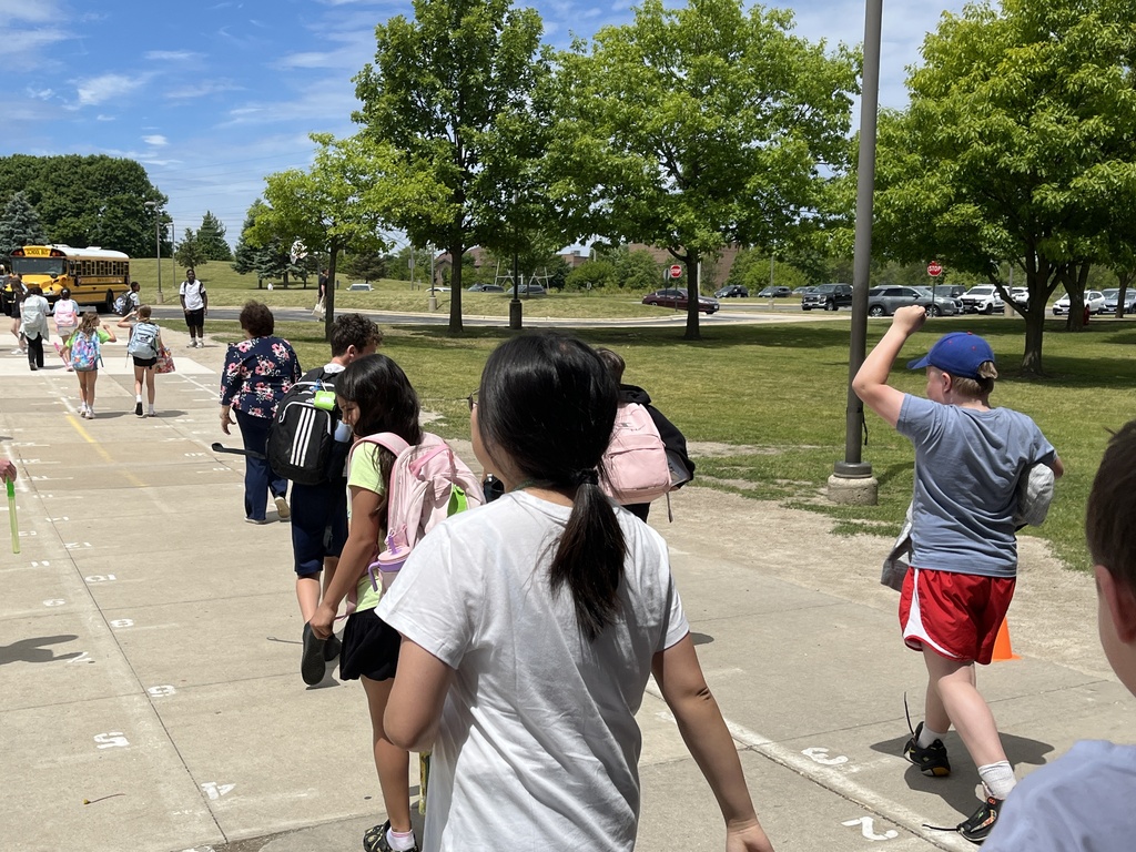 Last Day of School at Woodland Intermediate, students walking toward their buses