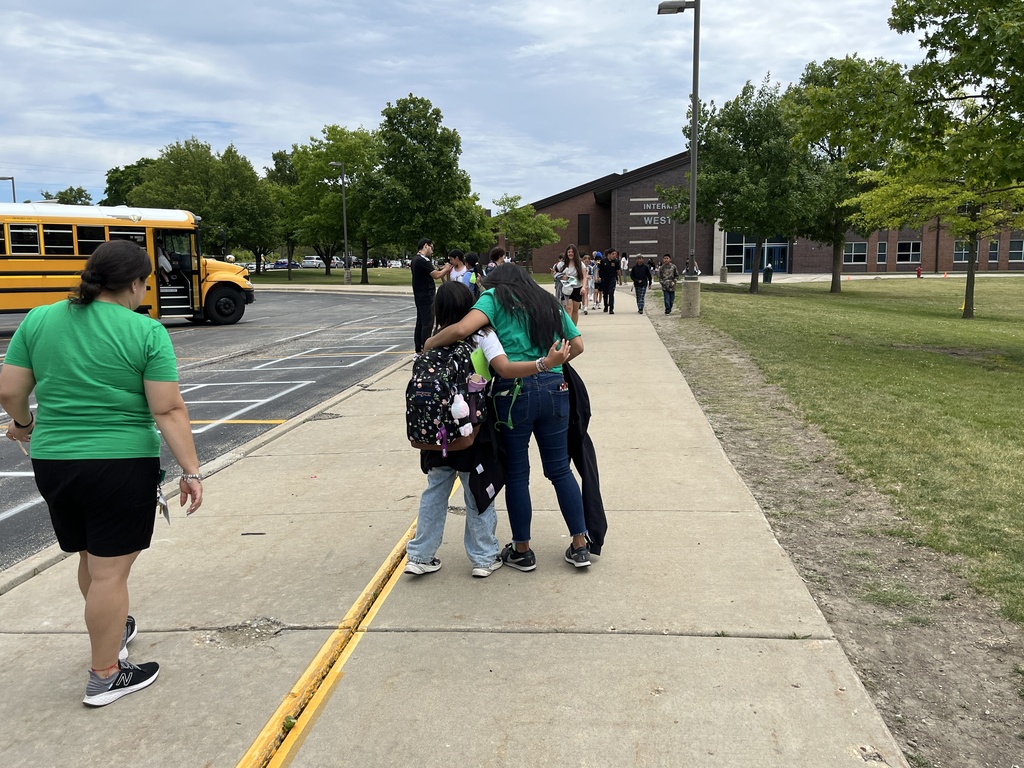 Last Day of School at Woodland Intermediate, students walking toward their buses