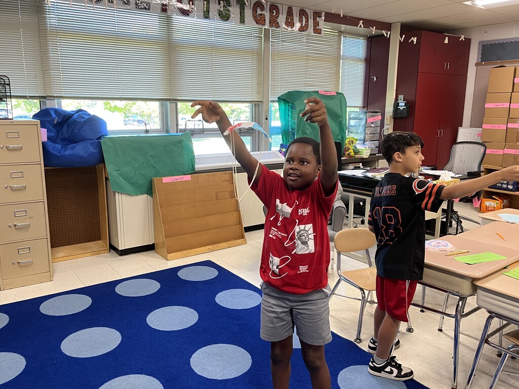 student tests the parachute he made