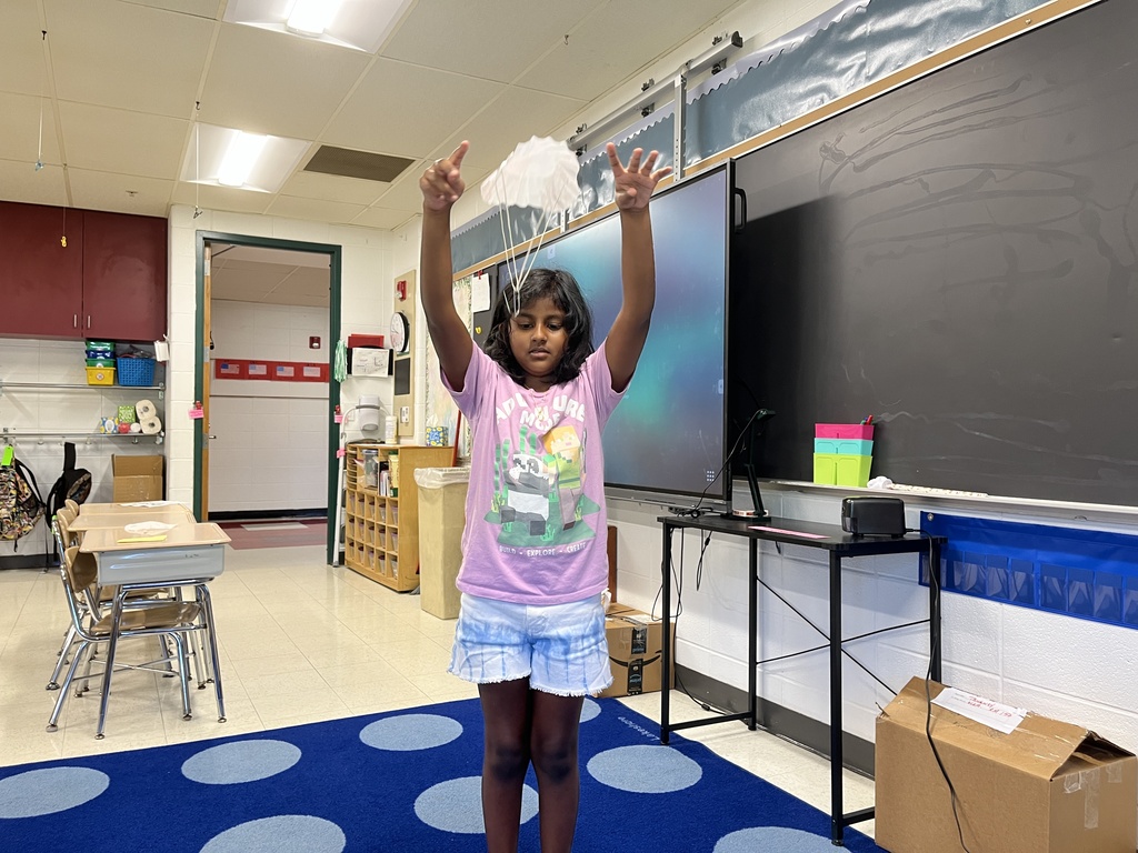 student tests the parachute she made