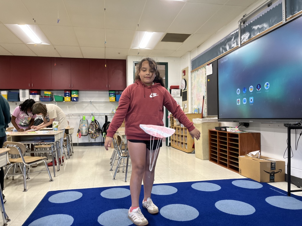 student tests the parachute she made