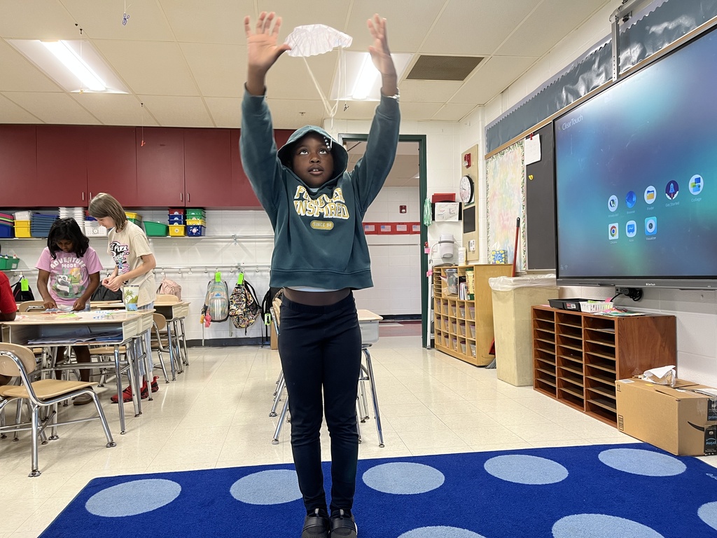 student tests the parachute she made