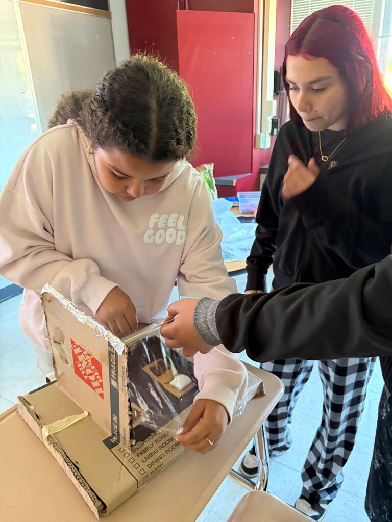 creating solar ovens to cook s'mores June 2026