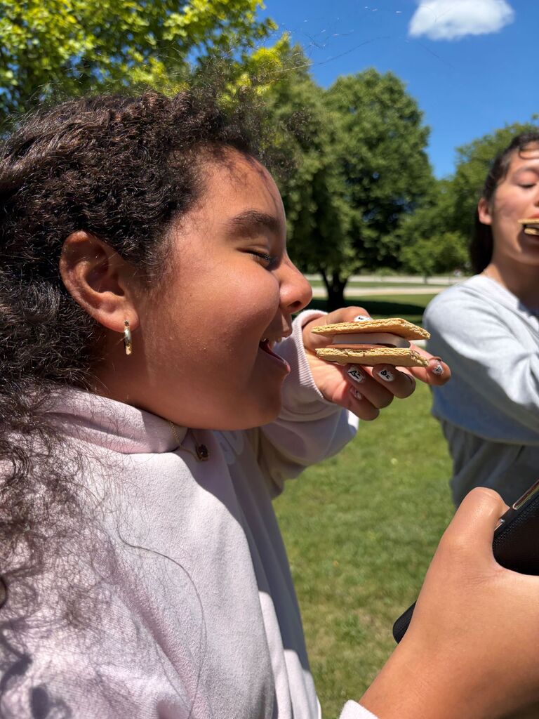 Student enjoys a s'more