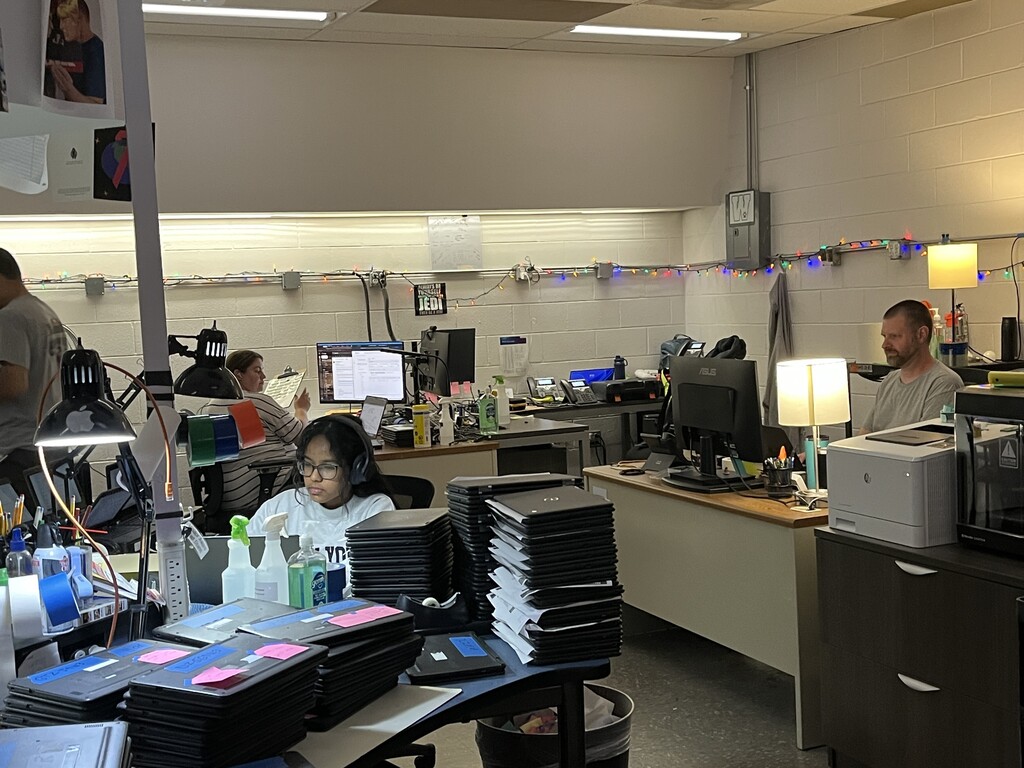 A volunteer helps out in the Tech Department during summer break