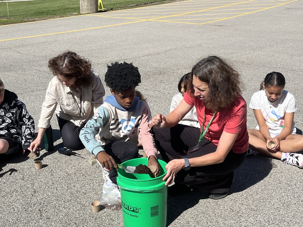 Adventures in Agriculture - planting seeds outside at summer school