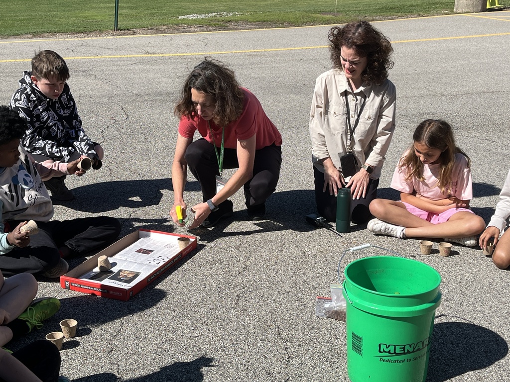 Adventures in Agriculture - planting seeds outside at summer school