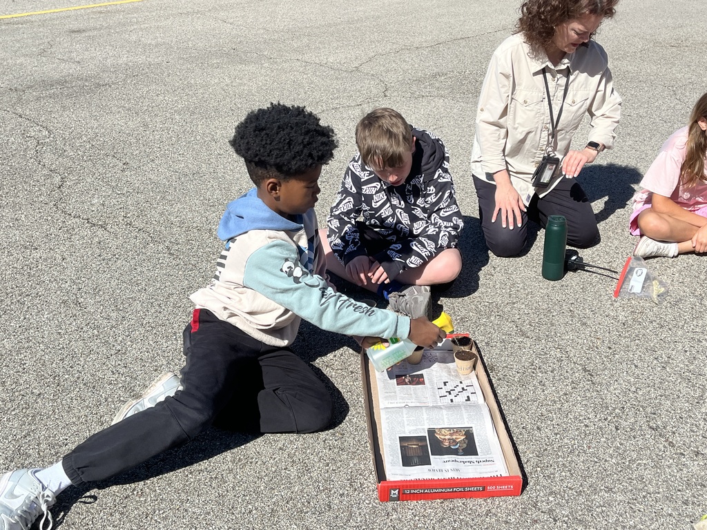 Adventures in Agriculture - planting seeds outside at summer school