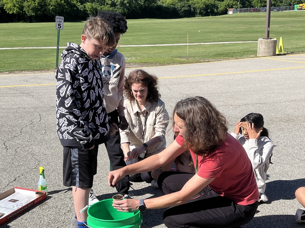 Adventures in Agriculture - planting seeds outside at summer school