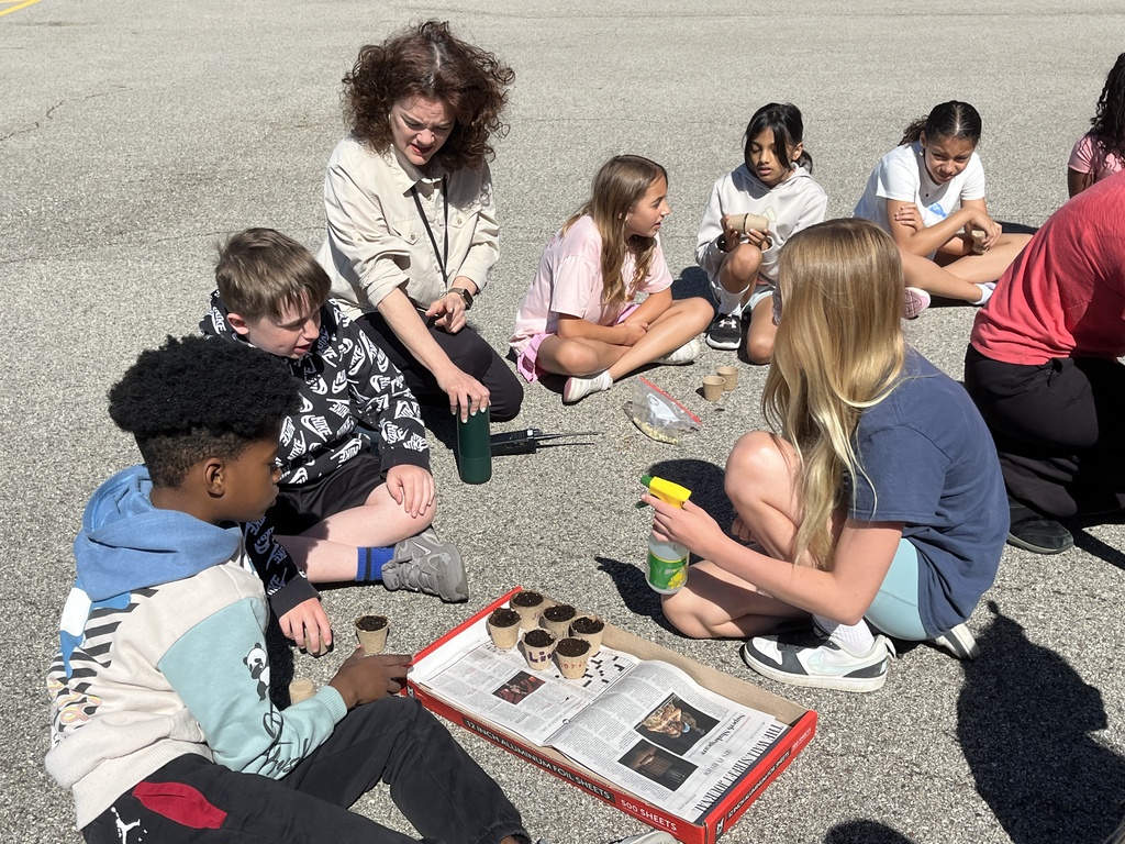 Adventures in Agriculture - planting seeds outside at summer school
