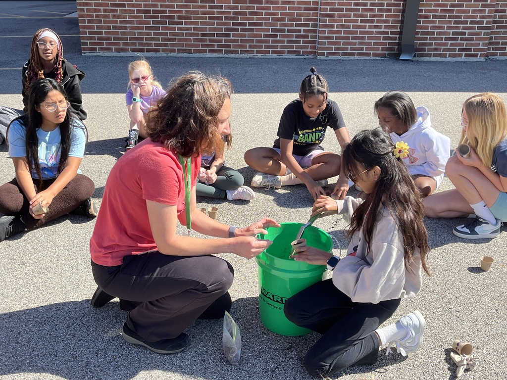 Adventures in Agriculture - planting seeds outside at summer school