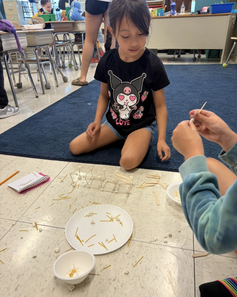 Students work together on a STEM challenge