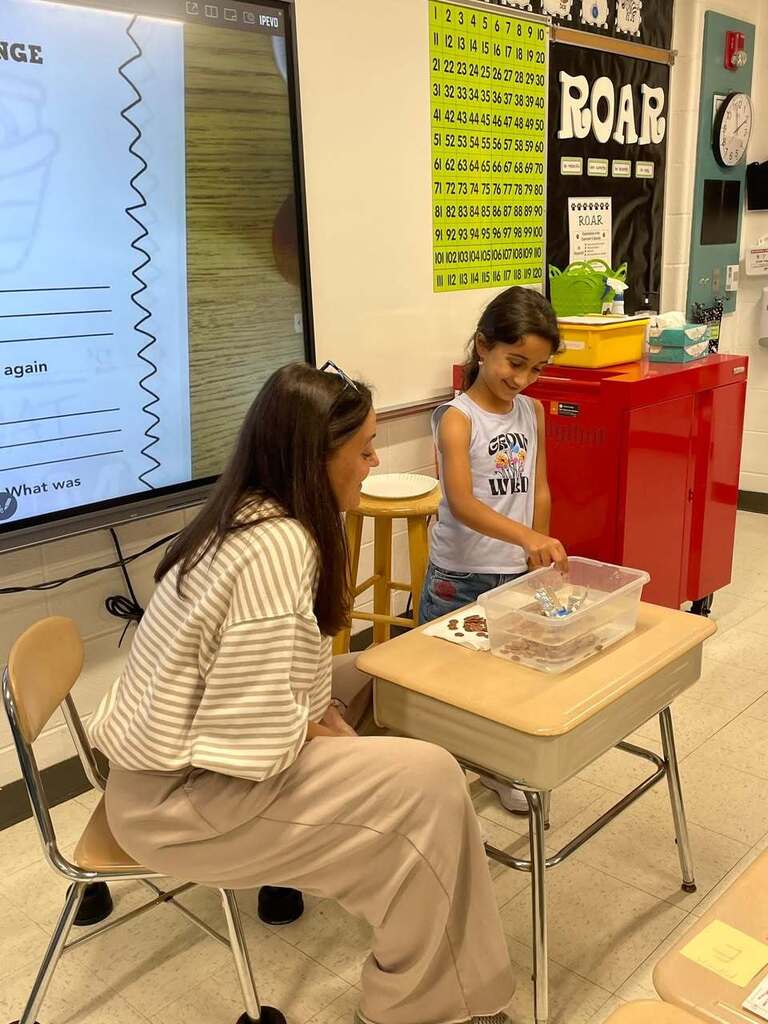 Ms Higgins class STEM activity of making boats out of tin foil. Students testing their boats in a tub of water 