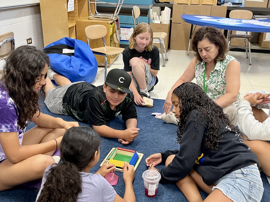Students playing a math game called Shut the Box at Summer School