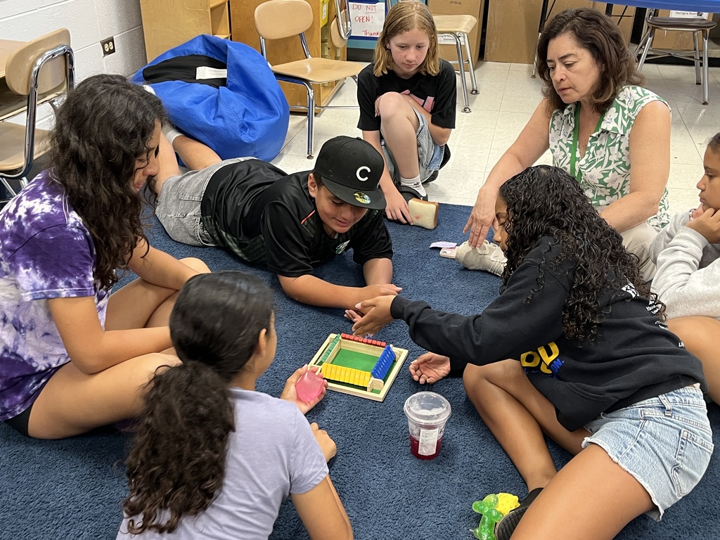 Students playing a math game called Shut the Box at Summer School