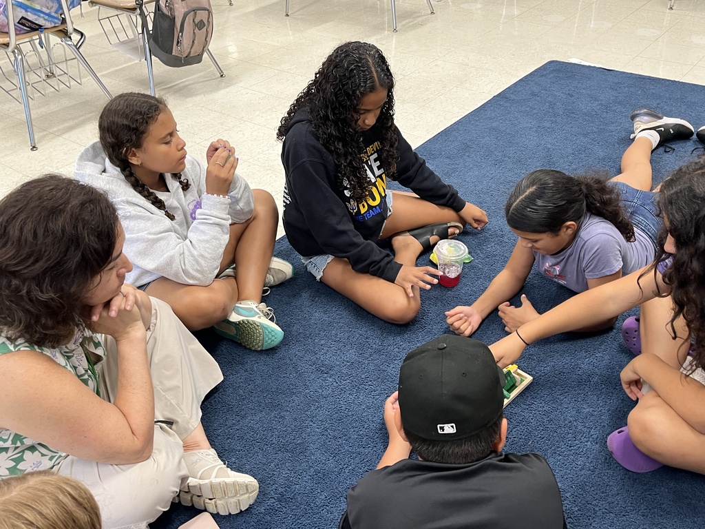 Students playing a math game called Shut the Box at Summer School