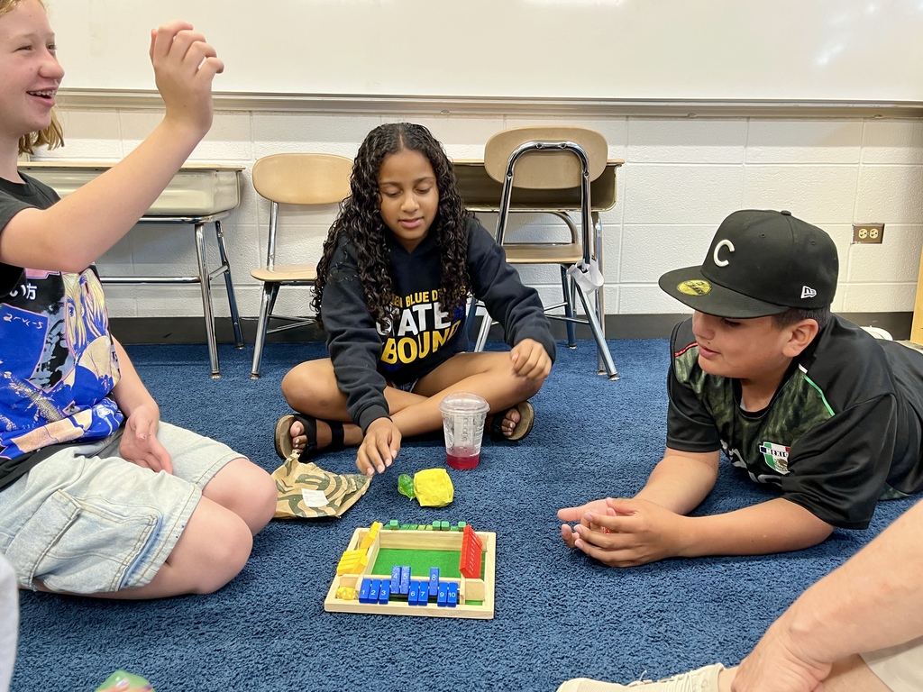 Students playing a math game called Shut the Box at Summer School