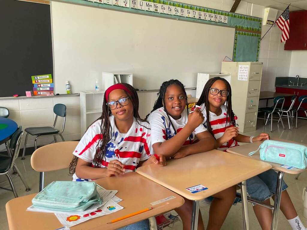 3 Smiling students 
