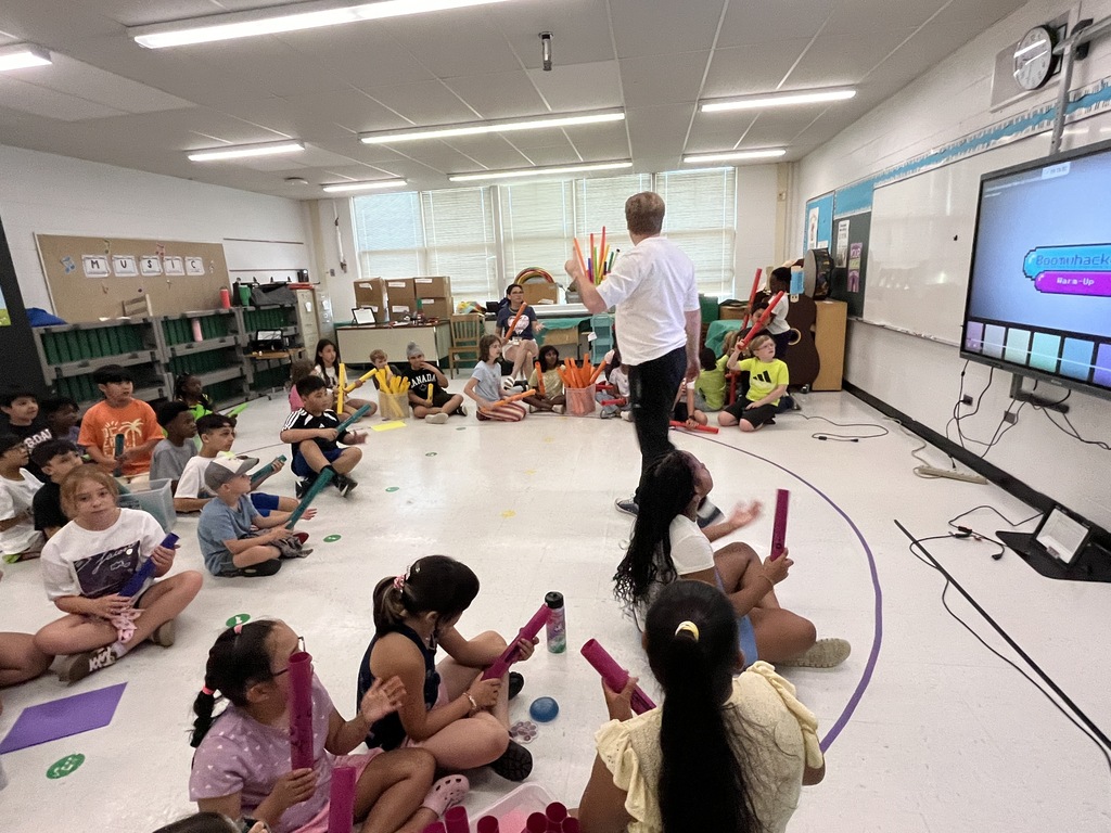 Field Day - kids in a music classroom keeping the beat